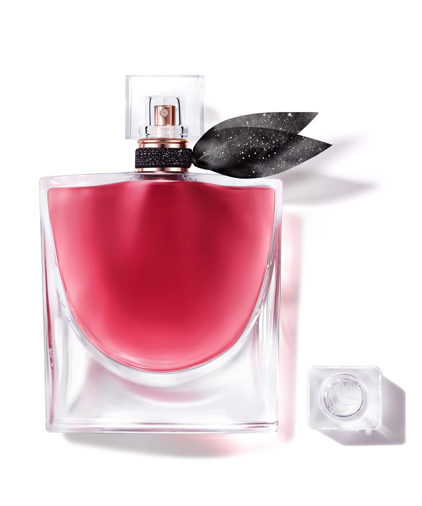 La Vie Est Belle L’ELIXIR, 100ML perfume bottle with pink liquid and black ribbon, symbolizing modern femininity.